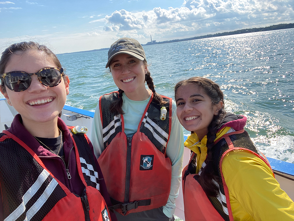 Kacey Clayton (left) during her time at the Batten School & VIMS, alongside Caroline DeVries M.S. ‘24 (center) and Claudia Moncada-Wireman M.A. ‘23 (right). Photo courtesy of Kacey Clayton.