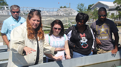 Acuff Center facility manager Lauren Gregg provides a tour of the oyster nursery pad during a public tour.